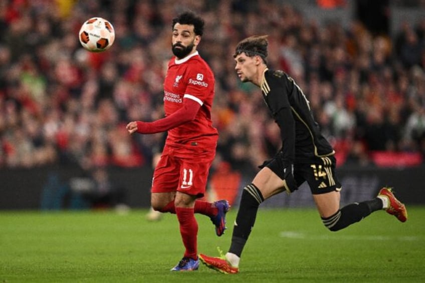 Mohamed Salah (left) has scored 12 times in 13 games for Liverpool against Manchester Unit