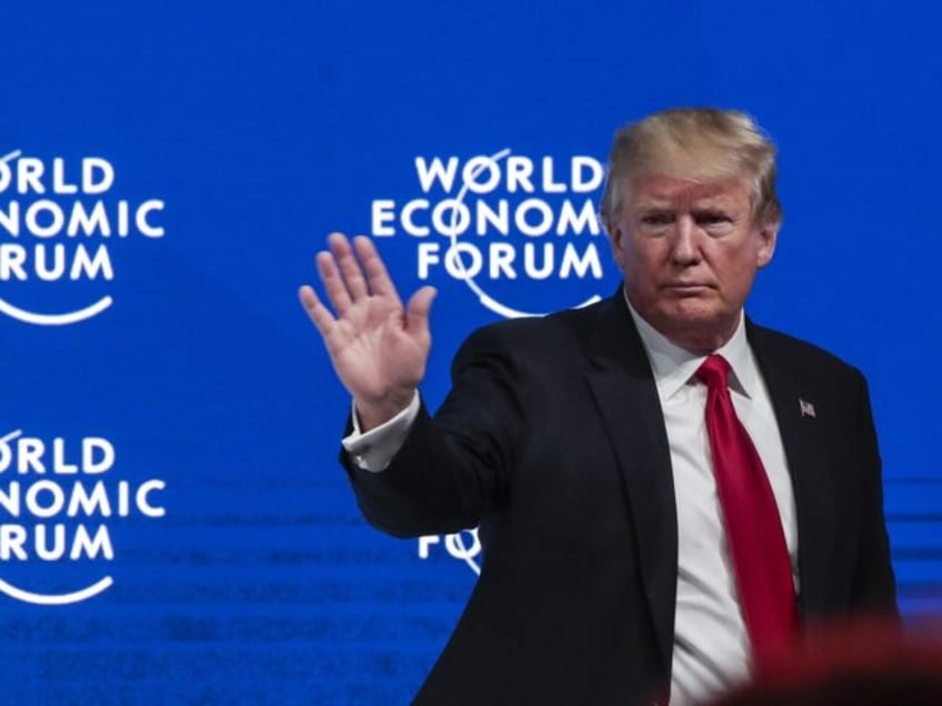 U.S. President Donald Trump waves to the audience following a special address on the closi