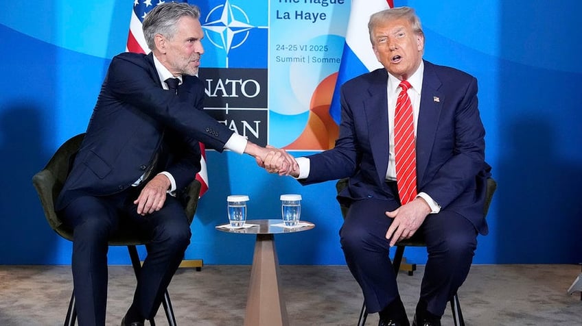 President Donald Trump and Netherlands' Prime Minister Dick Schoof shake hands at a NATO summit at the Hague.
