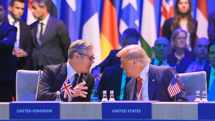 President Donald Trump speaks to Britain's Prime Minister Keir Starmer during a NATO summit at the Hague.