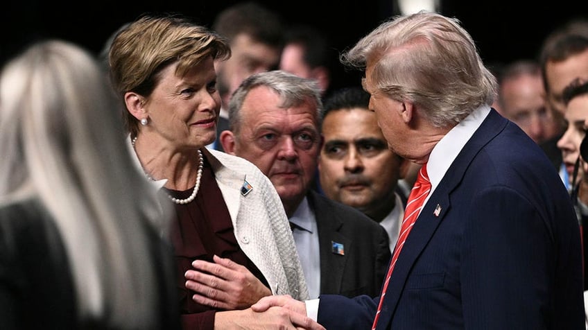 President Donald Trump greets Latvia's Foreign Minister Baiba Braze at the 2025 NATO summit.