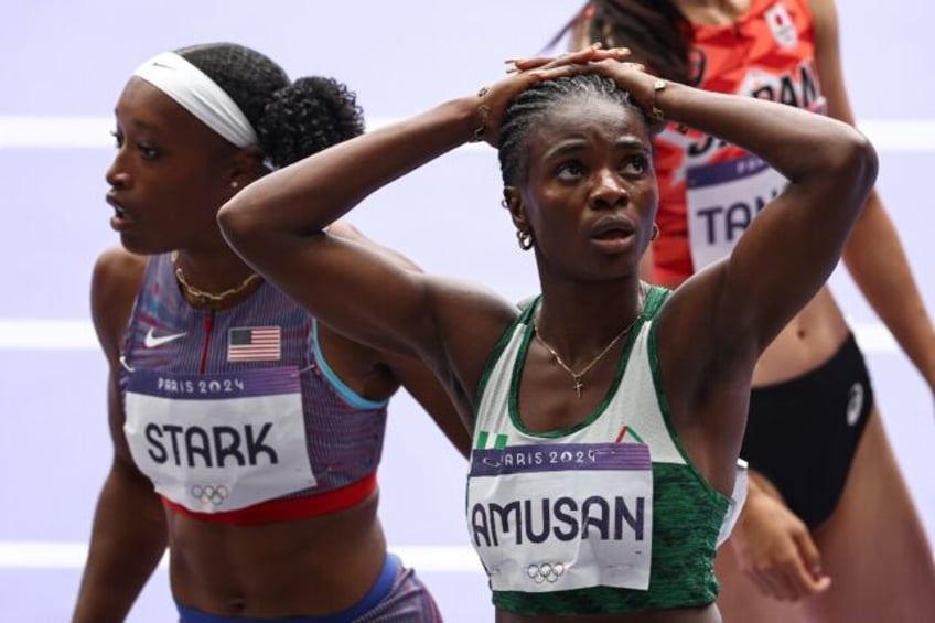 Nigeria's world record holder Tobi Amusan reacts after failing to qualify for the Olympic