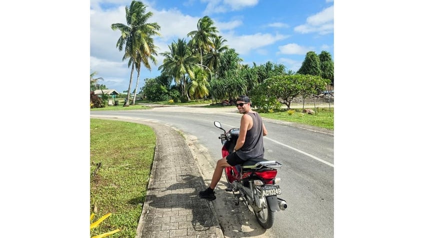 Hudson, a Pennsylvania resident, riding a moped in tuvalu