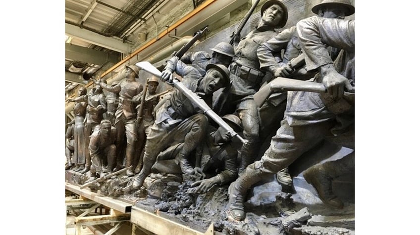 WWI soldiers depicted at battle in a sculpture