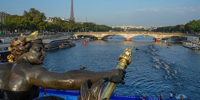worlds top female triathletes swim in paris seine river ahead of next years paris olympics