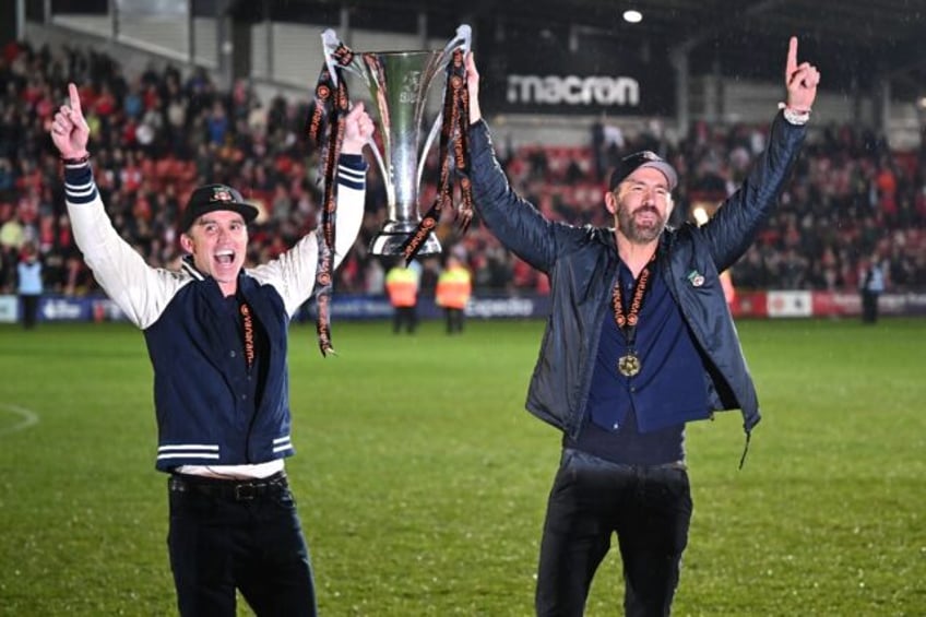 US actors Rob McElhenney (left) and Ryan Reynolds (right) celebrate Wrexham's National Lea