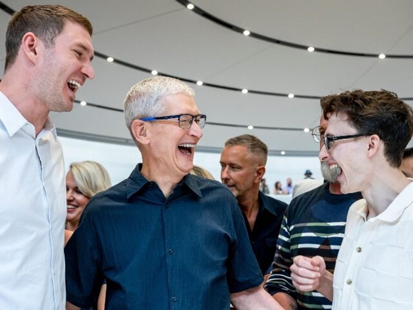 Tim Cook having a laugh at iPhone buyers