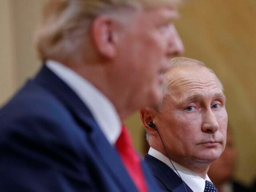 Russian President Vladimir Putin, right, looks over towards U.S. President Donald Trump, l