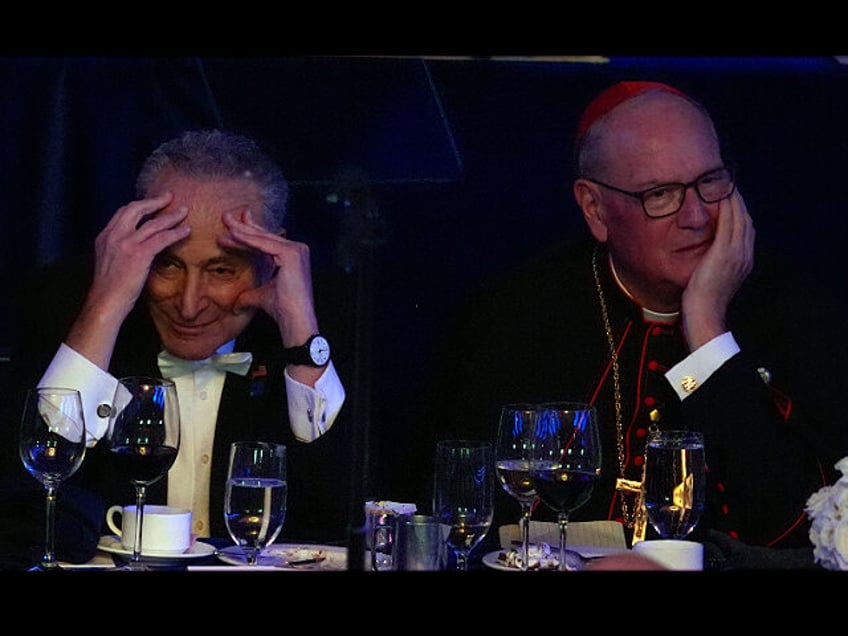 Senate Majority Leader Chuck Schumer of N.Y., and Cardinal Timothy Dolan watch a video mes