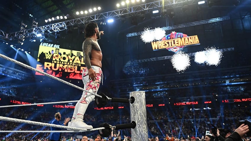 Jey Uso points to the WrestleMania 41 sign.