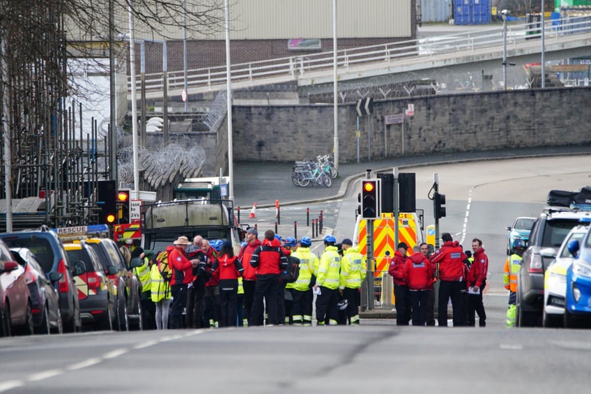 Emergency workers gather in Albert Road near to the Torpoint Ferry crossing in Plymouth, where a suspected Second World War explosive device, discovered in a garden in St Michael Avenue in the Keyham area of Plymouth, will be taken by military convoy to the Torpoint Ferry slipway to be disposed of at sea. Picture date: Friday February 23, 2024. (Photo by Ben Birchall/PA Images via Getty Images)