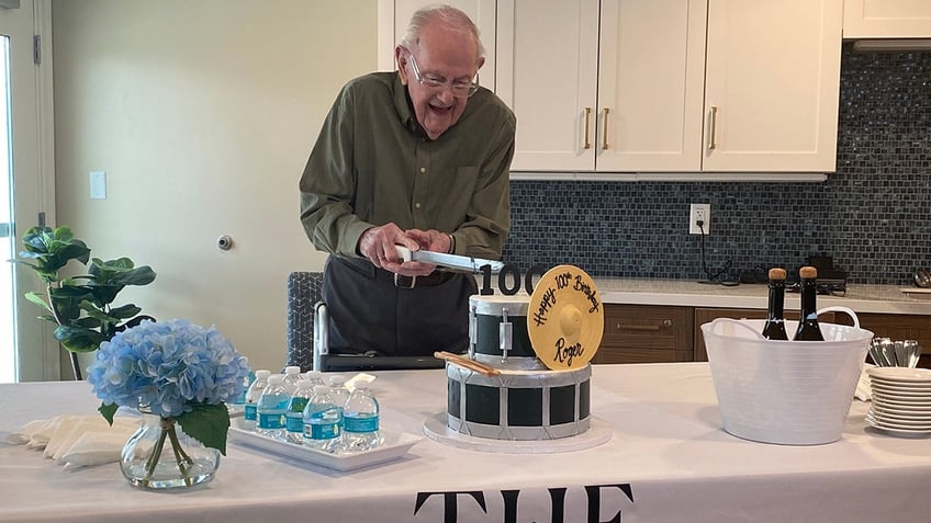 roger cutting birthday cake