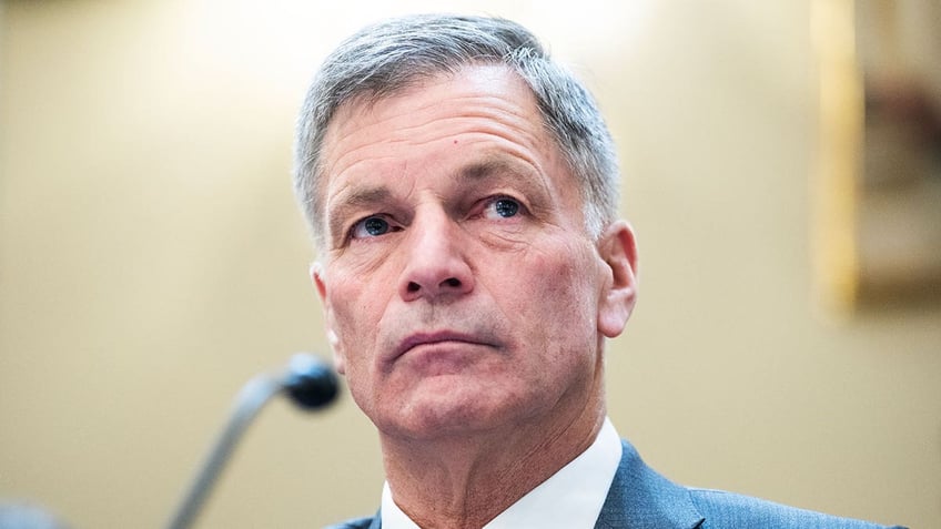 Mark Gordon sits in front of microphone during testifying