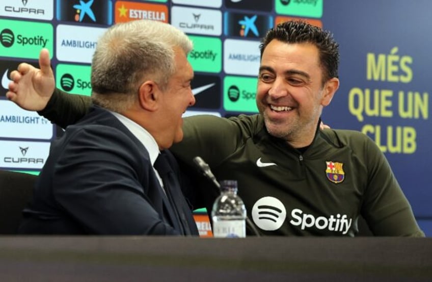 FC Barcelona president Joan Laporta (L) and coach Xavi (R) spoke on Thursday about the lat