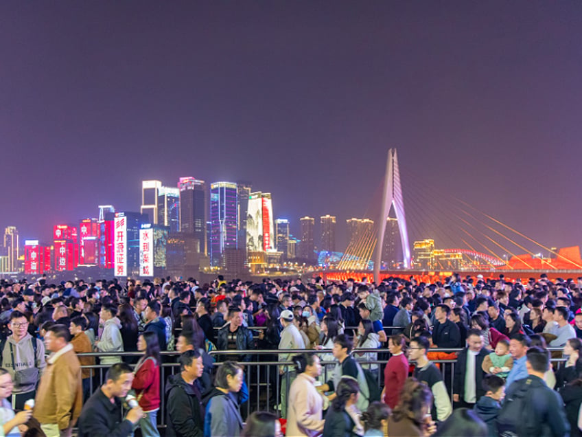 Tourists are visiting the Hongya Cave scenic area in large numbers in Chongqing, China, on February 18, 2024. The Ministry of Culture and Tourism is announcing the cultural and tourism market situation of the Spring Festival holiday for 2024. During the eight-day Spring Festival holiday, 474 million Chinese domestic tourists are making trips, which is an increase of 34.3% over the same period last year, and a 19.0% increase compared with the same period in 2019 on a comparable basis. Domestic tourists are spending a total of 632.687 billion yuan, up 47.3% year on year and up 7.7% compared with the same period in 2019 on a comparable basis. (Photo by Costfoto/NurPhoto via Getty Images)