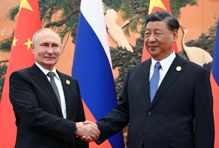 xi jinping vladimir putin hold 2 hour friendship meeting over tea in beijing