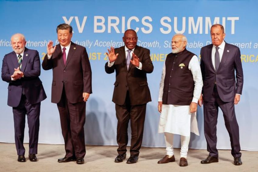 xi putin and other leaders locked in discussions over an expansion of the brics economic bloc