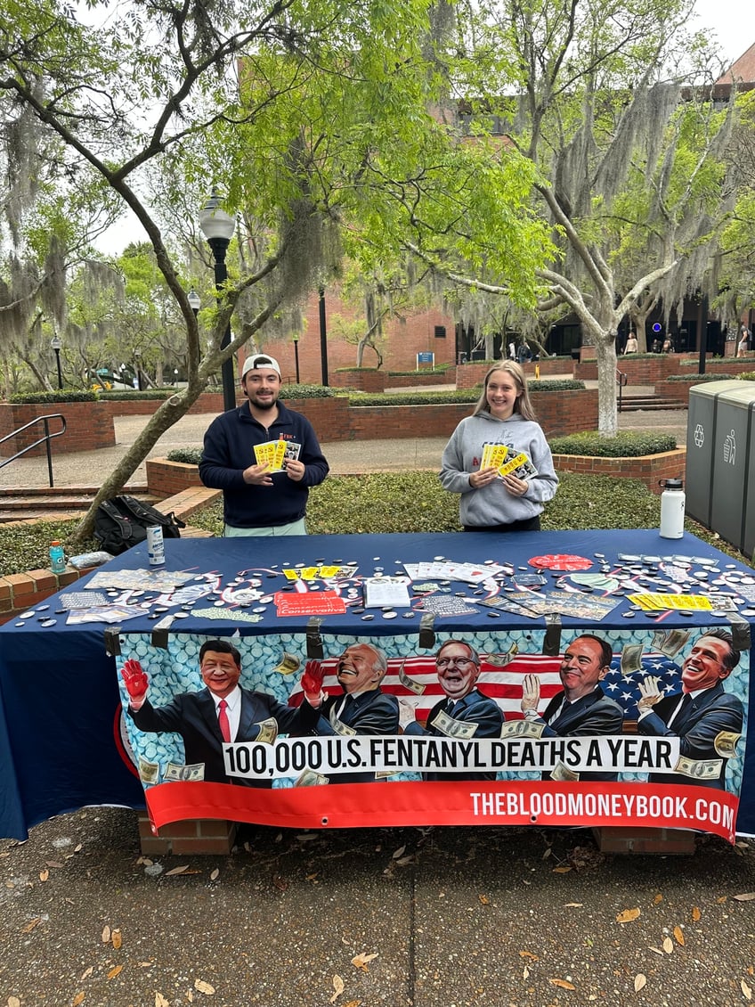 yaf students use schweizers blood money to warn students about the ccps subversion of america