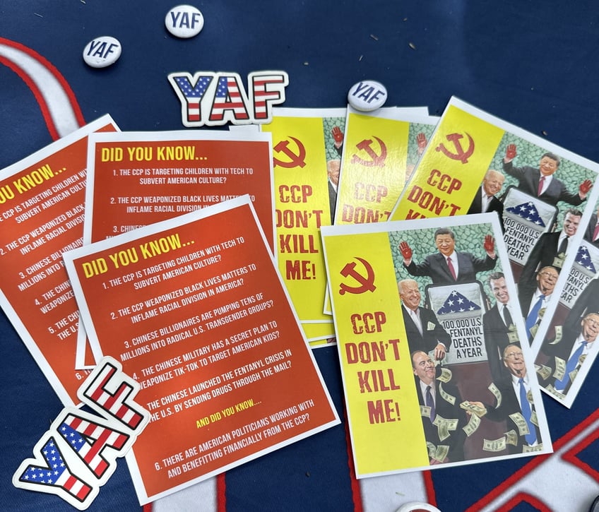 yaf students use schweizers blood money to warn students about the ccps subversion of america