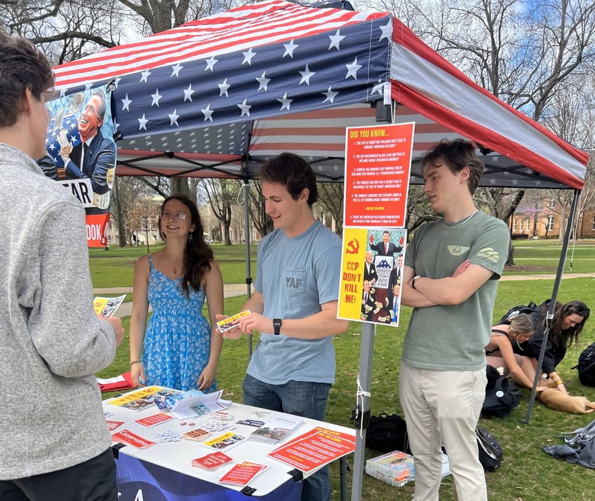 yaf students use schweizers blood money to warn students about the ccps subversion of america