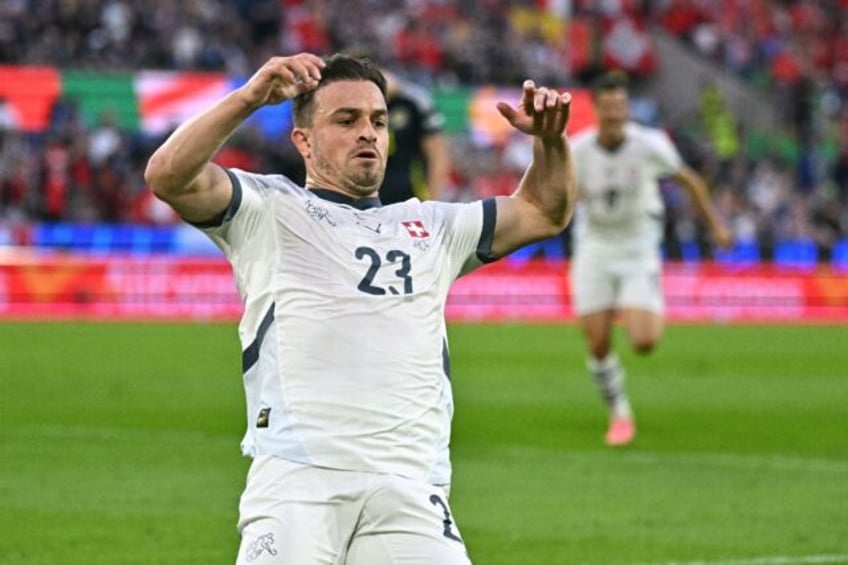 Switzerland's Xherdan Shaqiri celebrates scoring against Scotland