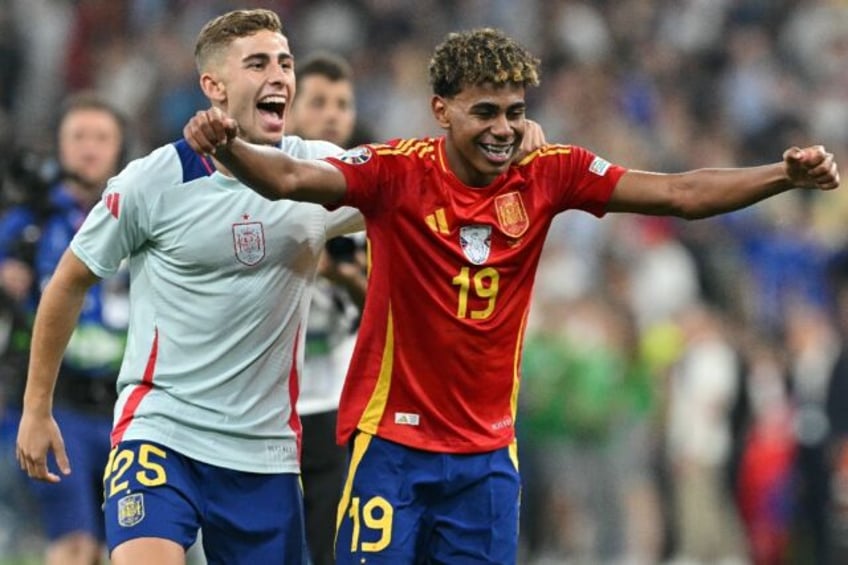 Spain's Lamine Yamal (R) became the youngest goalscorer in Euros history as he helped elim