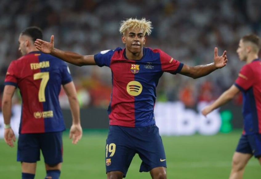 Barcelona's Spanish forward Lamine Yamal celebrates during the Copa del Rey final win over