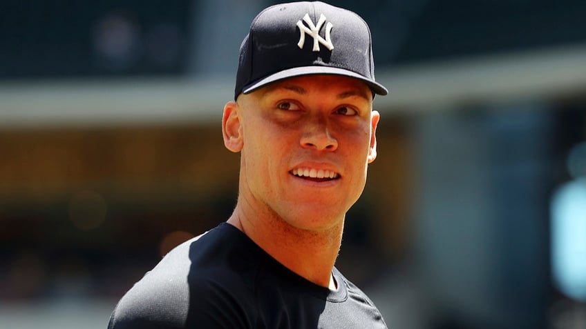 New York Yankees center fielder Aaron Judge (99) walks back to the dugout after taking a few warm-up throws before a baseball game against the Texas Rangers on Sunday, April 30, 2023, in Arlington, Texas. (AP Photo/Richard W. Rodriguez)