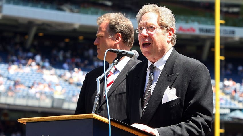 John Sterling speaks in microphone