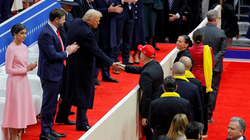 Relatives of hostages from the deadly October 7, 2023 attack by Hamas, greet President Donald Trump