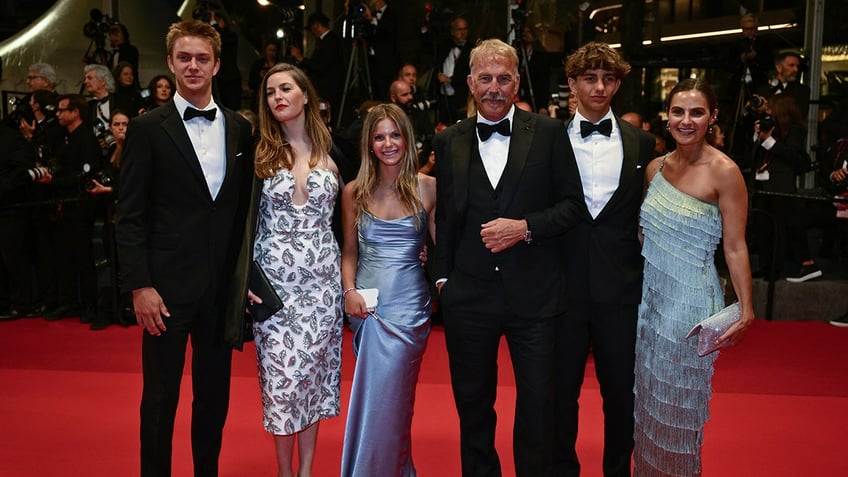 US actor Kevin Costner (3th R) poses with his children (From L) Cayden Wyatt Costner, Lily Costner, Grace Avery Costner, Hayes Costner and Annie Costner