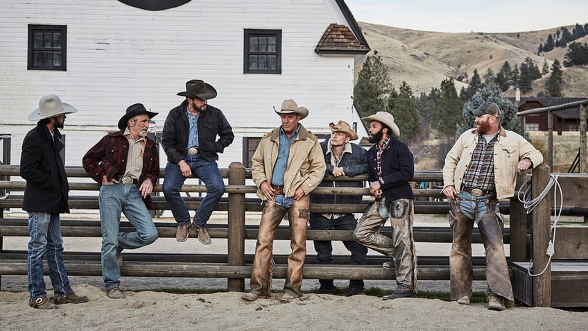 Yellowstone cowboys stand on their ranch.