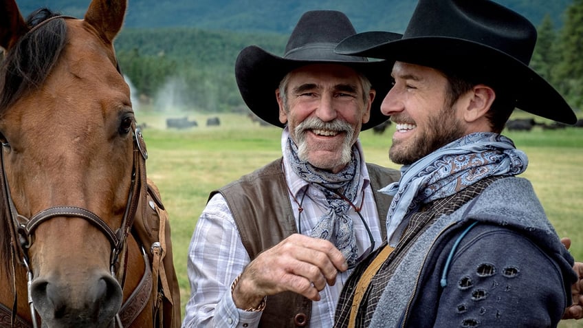 Forrie J. Smith wears a black hat and vest on Yellowstone