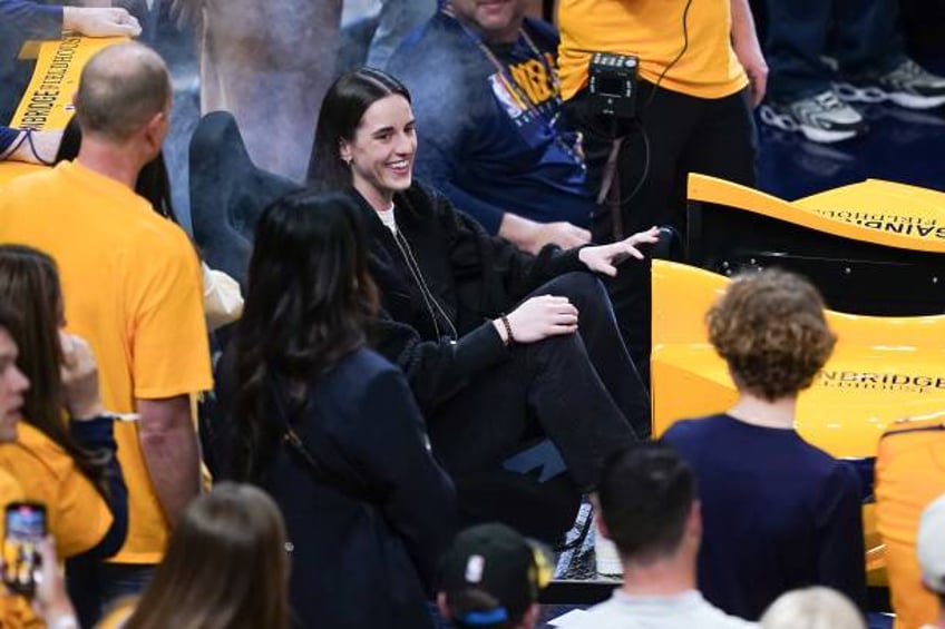 Caitlin Clark of the Indiana Fever participates in pre-game festivities before game three of the Eastern Conference First Round Playoffs between the...