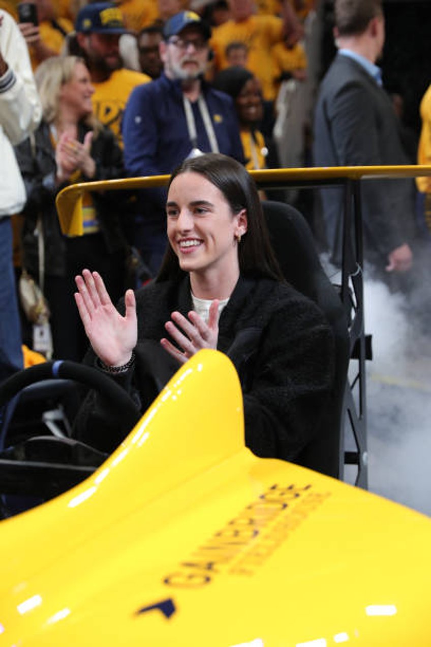 Caitlin Clark of the Indiana Fever smiles before the game between the Milwaukee Bucks and the Indiana Pacers during Round 1 Game 3 of the 2024 NBA...