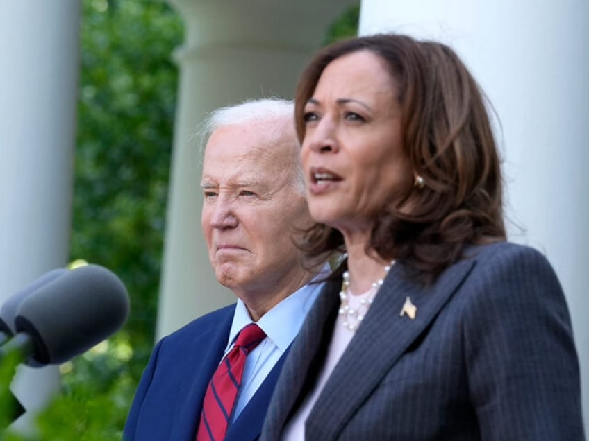 Vice President Kamala Harris speaks as President Joe Biden listens …