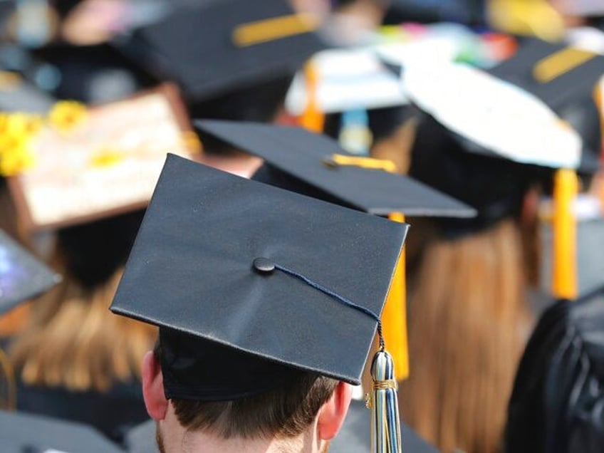 In this May 5, 2018, file photo, students attend the University of Toledo commencement cer