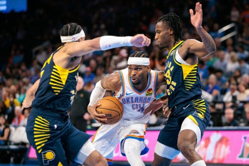 NBA Most Valuable Player Shai Gilgeous-Alexander of Oklahoma City drives to the basket aro
