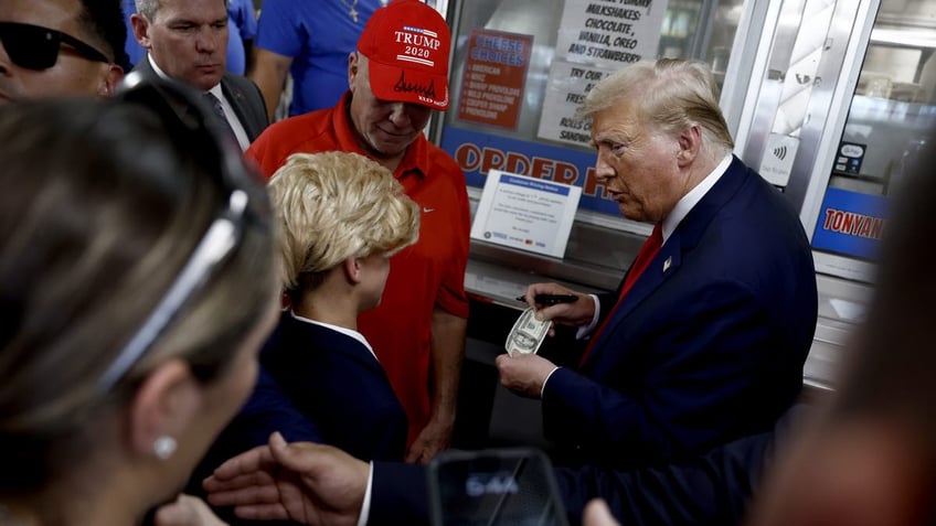 Trump meets young fan dressed as him