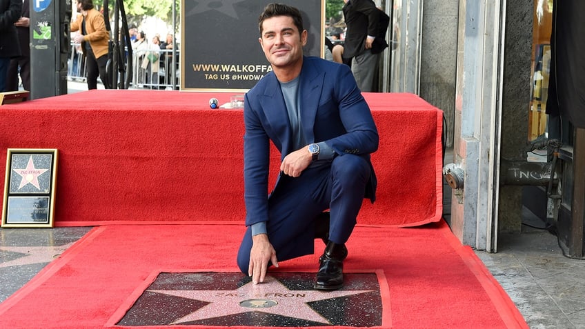 Zac Efron by his star on the Walk of Fame