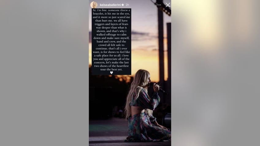 Kelsea Ballerini kneels on stage in an Instagram story where she updates fans on her well-being after being hit with a bracelet in the eye