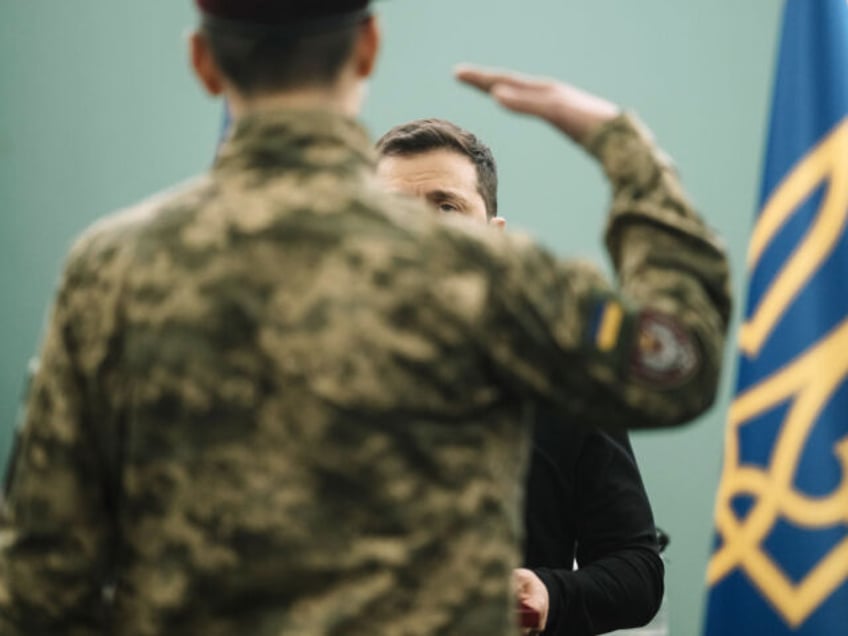 Volodymyr Zelenskiy, Ukraine's president, with a Ukrainian serviceman before an Iftar