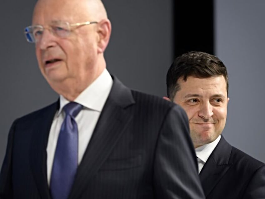 Ukraine's President Volodymyr Zelensky (R) looks on as he follows World Economic Forum (WEF) founder and executive chairman Klaus Schwab prior to delivering a speech at the World Economic Forum (WEF) annual meeting in Davos, on January 22, 2020. (Photo by Fabrice COFFRINI / AFP) (Photo by FABRICE COFFRINI/AFP via …