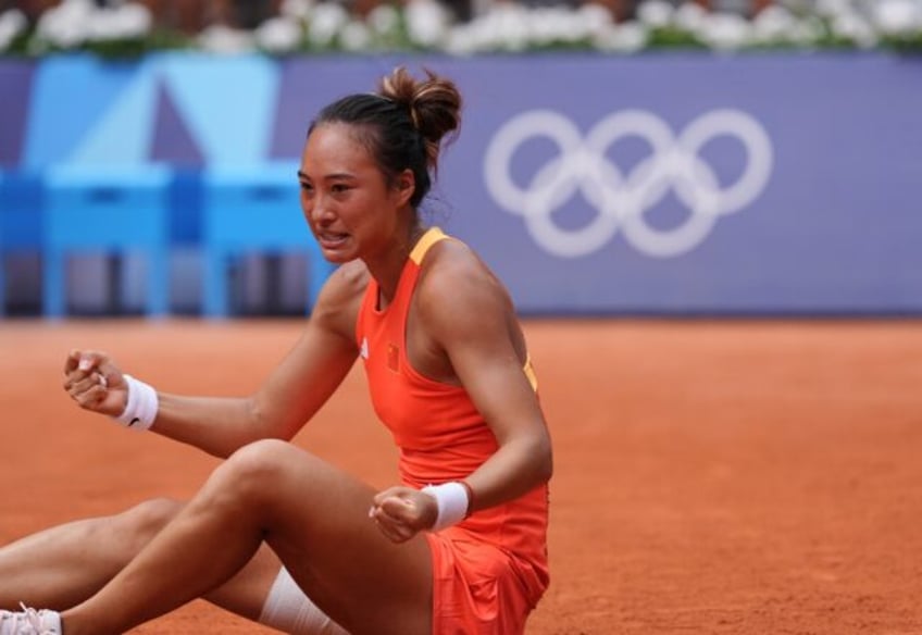 Triumph: China's Zheng Qinwen reacts to beating Poland's Iga Swiatek