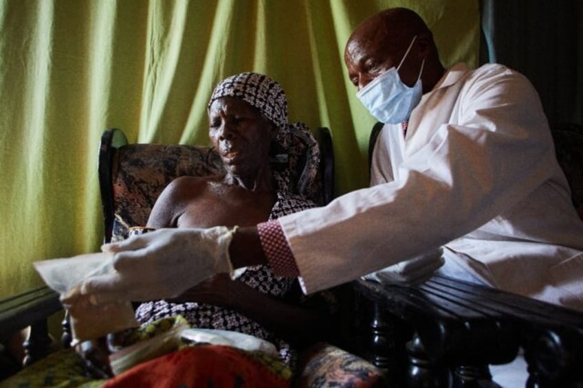 Agnes Kativhu, 67, has a consultation with herbalist Never Chirimo at his clinic in Harare