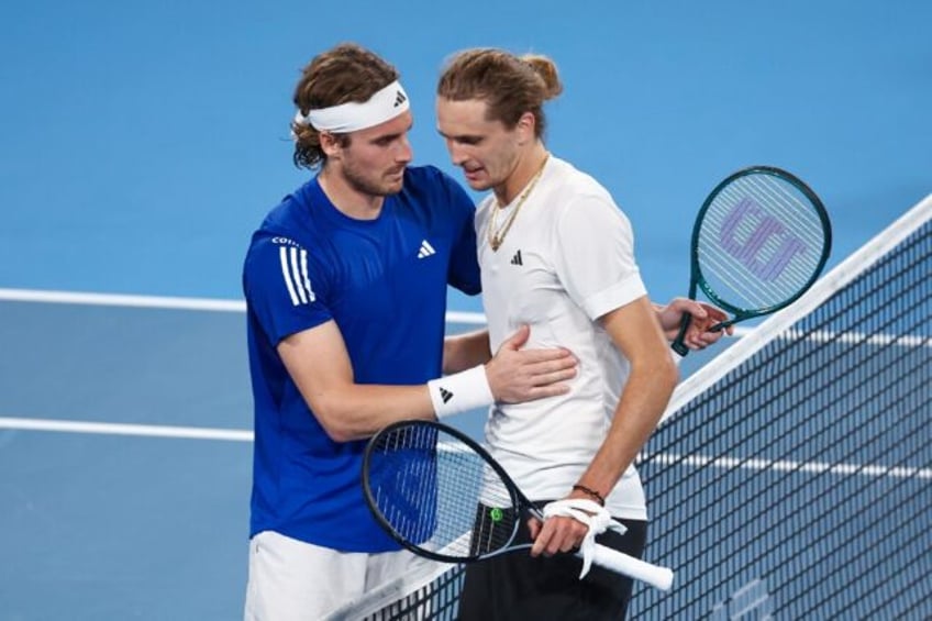 Germany's Alexander Zverev (R) shakes hands with Greece's Stefanos Tsitsipas at the United Cup